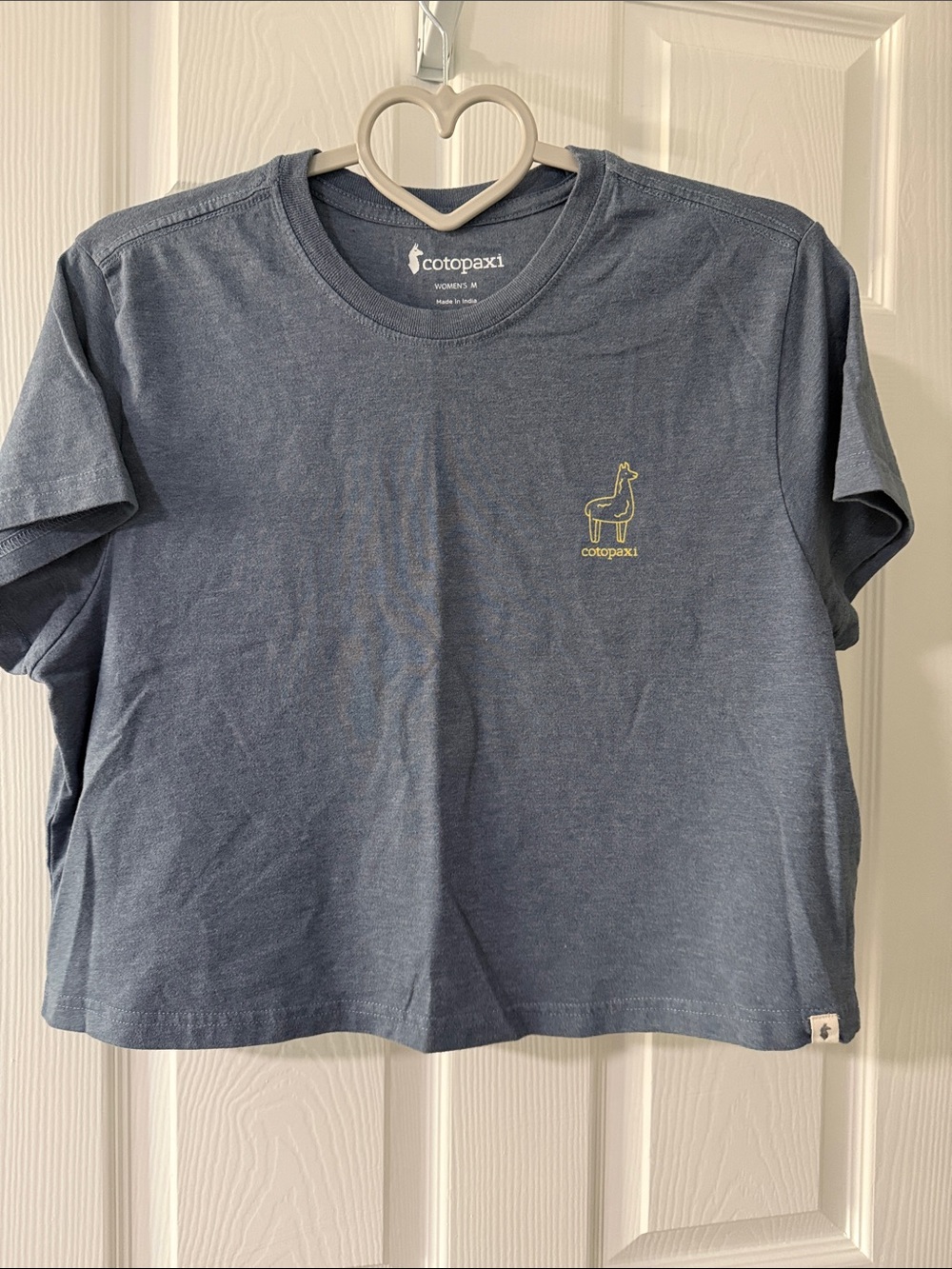 cotopaxi navy blue short sleeve tee with yellow logo